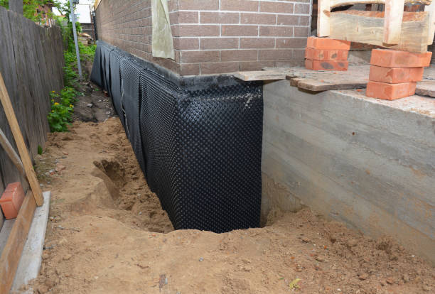 Happy homeowners after waterproofing job in New Hope